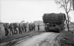 Churchill AVRE fascine carrier passing British infantrymen during the attack towards Hertogenbosch, the Netherlands, 23 Oct 1944