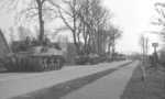 Troops of the Canadian Royal Hamilton Light Infantry aboard Kangaroo armored personnel carriers converted from Ram tanks, near Groningen, the Netherlands, 13 Apr 1945