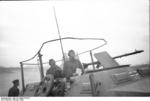 A German Luftwaffe Oberleutnant (Senior Lieutenant) performing air traffic control in the field in a specially-modified SdKfz. 251 vehicle, Russia, Oct 1943, photo 2 of 4; note MG34 machine gun