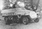 Polish resistance fighters repairing a captured SdKfz. 251 halftrack vehicle, Warsaw, Poland, 14 Aug 1944, photo 2 of 2