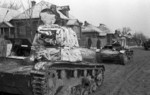 Soviet T-26 tanks in a village, Russia, 10 Oct 1941