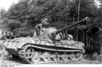 A German Tiger II tank being painted, France, Jun 1944, photo 2 of 3