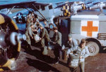 Marmite cans with blood collected from rear echelon troops in England, United Kingdom were being transferred from Dodge WC54 Ambulance to waiting Noorduyn UC-64A Norseman for air transport to Normandy