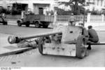 German crew of a 7.5 cm PaK 40 anti-tank gun resting in front of the Italian State Radio at the corner of Via Asiago and Via Montello, Rome, Italy, 11 Sep 1943.