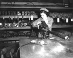 Female US Marine Private Marion Pillsbury working on a Browning M1919 machine gun at Marine Corps Base San Diego, California, United States, circa 1943