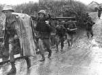 French soldier carrying a M18 recoilless gun in Hoa Binh Province, Vietnam, 1952