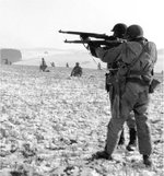 American troops firing M1 Garand rifles near Bastogne, Belgium, circa Dec 1944