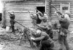 Soviet troops posing with PPSh-41 submachine guns and a captured German MG34 machine gun, circa 1940s