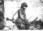 German soldier with MG42 machine gun, Caen, France, Jun 1944