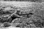 German soldier testing a captured British PIAT anti-tank launcher, France, circa May 1944