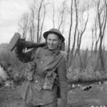 Private G. Mills of British 2nd Gloucestershire Regiment with a PIAT launcher, northwestern Europe, 6 Mar 1945