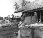 Malayan policeman with Sten gun at the police station in Pengkalan Kubor, Malaya, 22 Jul 1950