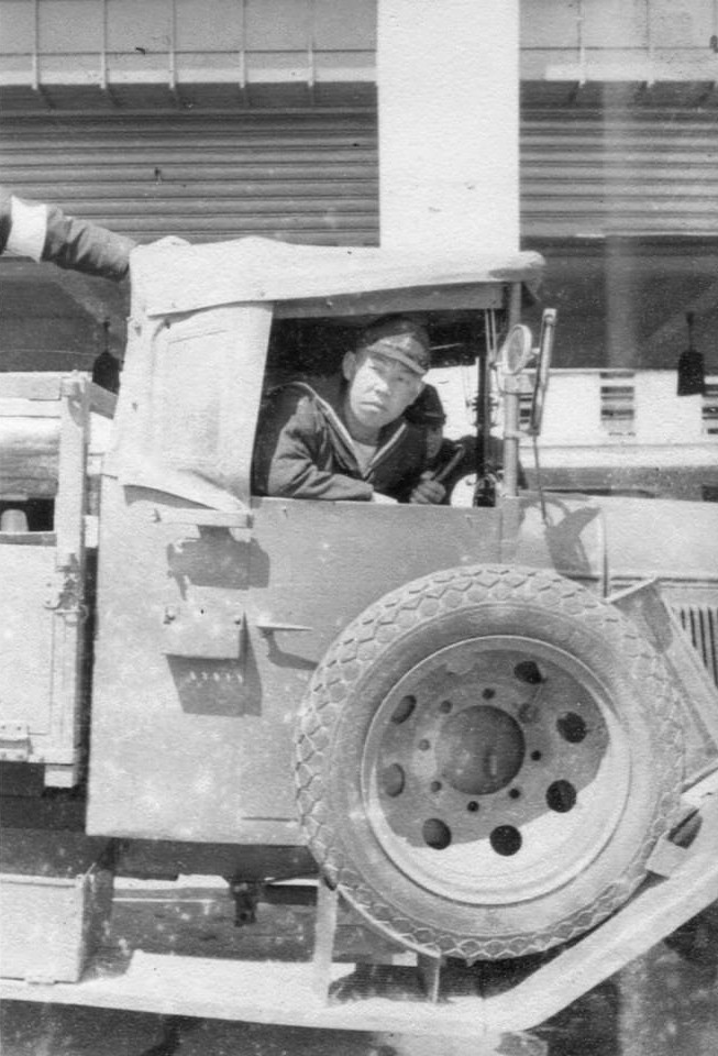 Japanese Navy sailor aboard a truck, circa 1940s