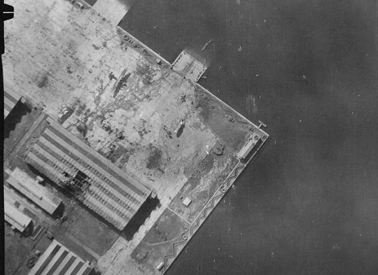 Aerial view of the Japanese Navy seaplane base at Toko Bay (now Dapeng Bay), southern Taiwan, 13 Oct 1944; photo taken by aircraft from USS Hornet