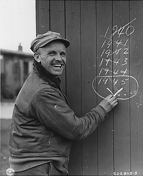 British Sergeant Edward Hill, captured by the Germans at Dunkerque, France in 1940, smiling as he was librated in late Mar 1945