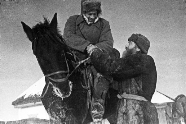 A Russian villager bidding farewell to a friend who was enlisting in the Soviet military, 1940s