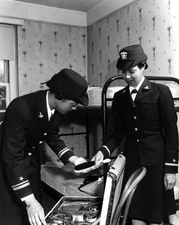 WAVES Lieutenant (jg) Harriet Ida Pickens and Ensign Frances Wills packing following graduation from the Naval Reserve Midshipmen's School, Northampton, Massachusetts, United States, circa Dec 1944