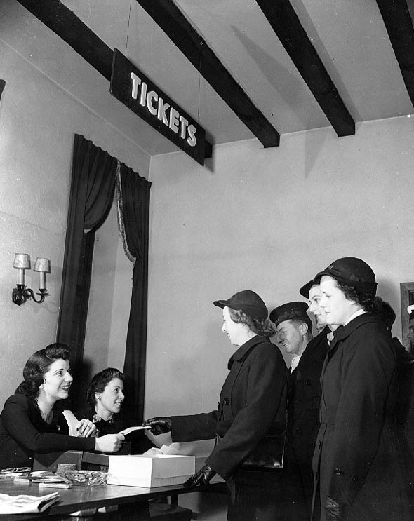 US Navy WAVES personnel and British Royal Navy sailors obtaining free theater tickets from New York's Defense Recreation Committee, New York, United States, circa 1943