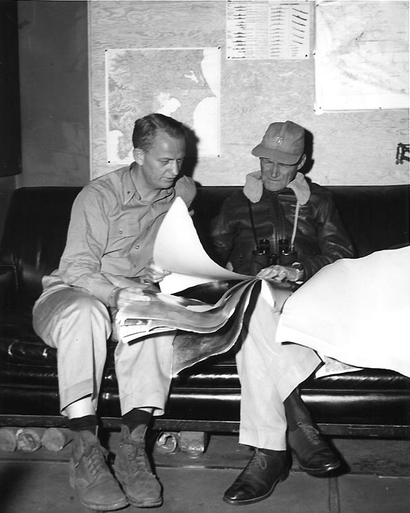 Commodore Burke and Vice Admiral Mitscher aboard carrier Bunker Hill while off Japan, Feb 1945