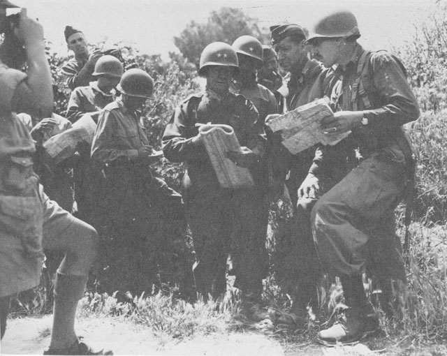 US generals Geoffrey Keyes, Robert Frederick, and Mark Clark in discussion near Rome, Italy, May-Jun 1944