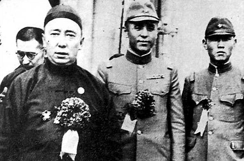 Chairman Demchugdongrub of the Mengjiang puppet government with Li Shouxin and a Japanese officer, Kalgan, Chahar Province, China, circa 1940s