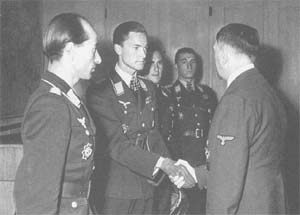 German pilots Hartmann Grasser, Heinrich Prinz zu Sayn-Wittgenstein (shaking hands with Hitler), Günther Rall, and Walter Nowotny with Adolf Hitler at Wolfsschanze, Ostpreußen, Germany (now Gierloz, Ketrzyn, Poland), 22 Sep 1943