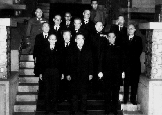 Japanese Prime Minister Kantaro Suzuki (front row, center) with members of his cabinet on his inaugural day of administration, Tokyo, Japan, 7 Apr 1945; note Mitsumasa Yonai (front row, first from right) and Korechika Anami (rear row, first from left)