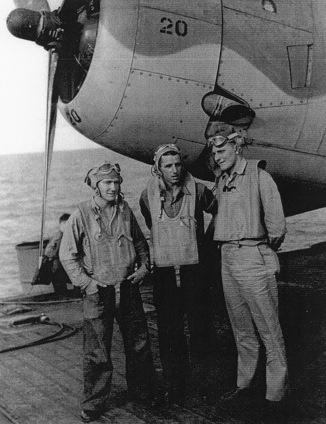 Aviation Machinist's Mate 3rd Class D. E. Ritch, Aviation Radioman 3rd Class R. L. Burgess, and Ensign C. R. Rasmussen aboard USS Coral Sea, 30 Oct 1943