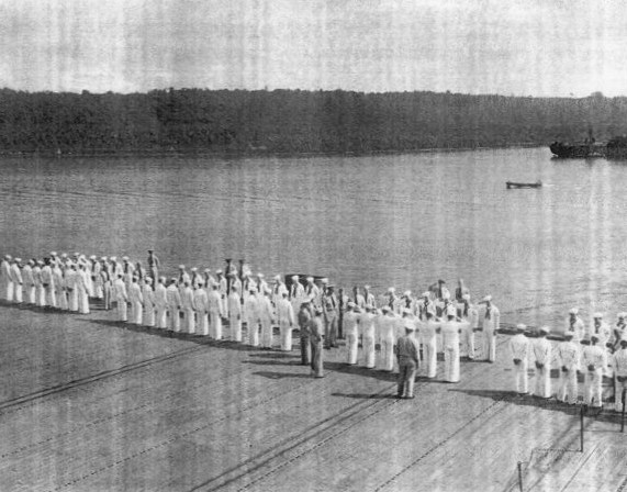 Captain Paul W. Watson of USS Coral Sea inspecting the A Division on the flight deck, 27 May 1944