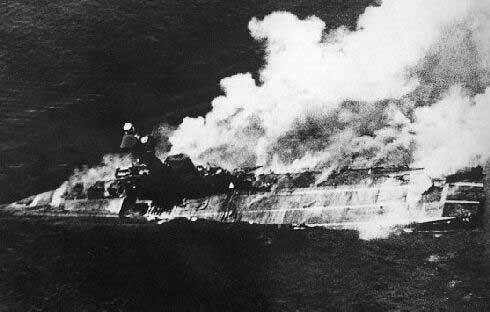 HMS Hermes sinking off Batticaloa, Ceylon, 9 Apr 1942; photograph taken from a Japanese aircraft