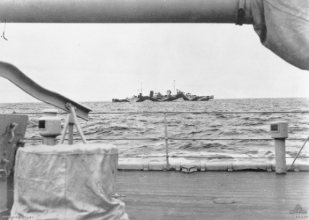 Starboard side view of the cruiser HMAS Perth, circa 1942; note camouflage using colors 507A and 507C and Seagull V aircraft