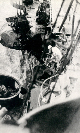 Repairing a machine gun position aboard Shokaku, which was damaged by the third bomb hit during Battle of the Coral Sea, , Kure, Japan, between 17 May and 27 Jun 1942