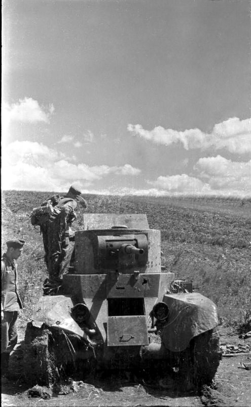 German soldiers inspecting a destroyed Russian BT-5 tank, Jul 1941