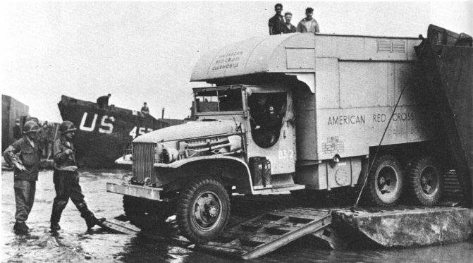 CCKW 2 1/2-ton 6x6 of the American Red Cross exiting landing craft during the Normandy campaign, France, 1944