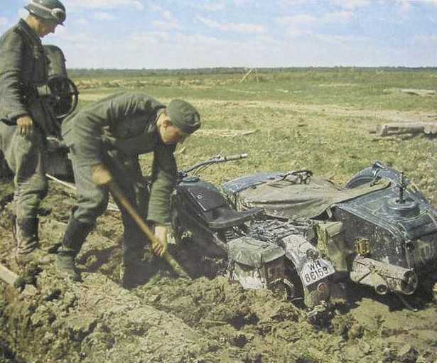 German soldier recovering a mired KS600 motorcycle, 1940s