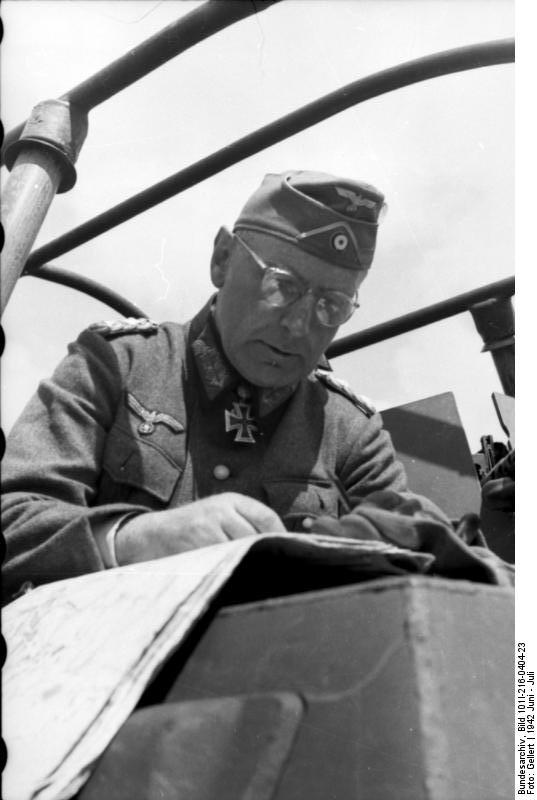 German Army general reading a map in a SdKfz. 251/6 halftrack vehicle, Russia, Jun 1942