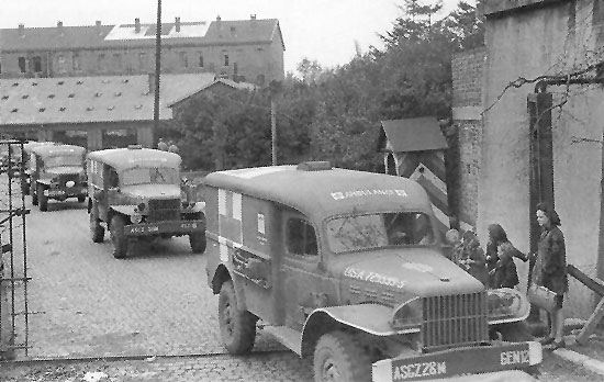 Convoy of Dodge WC54 ambulances leaving the 28th General Hospital, Liège, Belgium, fall 1944