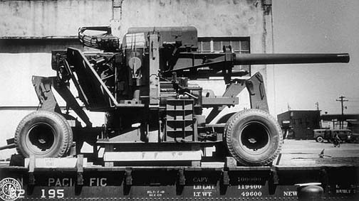 120 mm Gun M1 anti-aircraft weapon of US 85th Antiaircraft Artillery Gun Battalion loaded onto a rail flat car at Norfolk Army Base, Norfolk, Virginia, United States, 10 Apr 1944