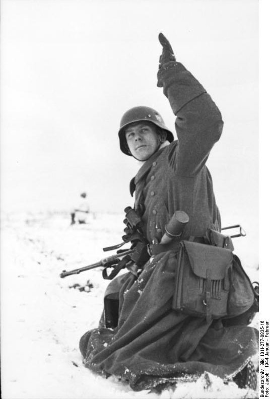 German soldier in wintry terrain with MP 40 submachine gun and Model 24 Stielhandgranate, Russia, Jan-Feb 1944