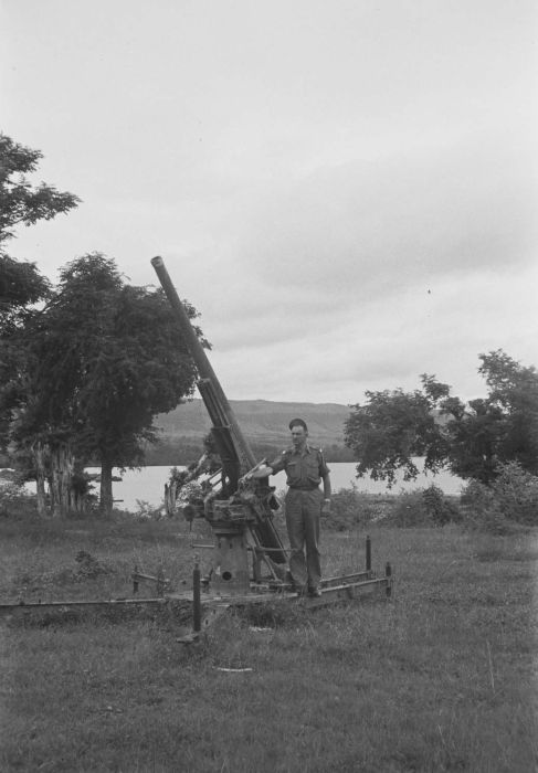 Dutch soldier with a captured Japanese Type 88 75mm anti-aircraft gun, Waingapu, Dutch East Indies, 25 Feb 1949